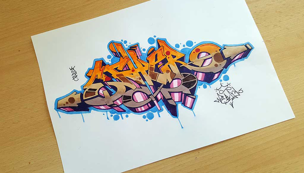 Photo of a wildstyle ether graffiti drawing with a gradient fillin from orange to brown and a blue keyline and blue bubbles as background