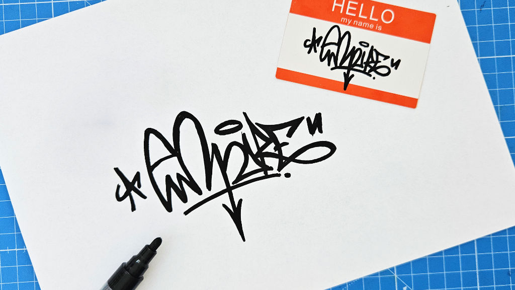 Photo of an empire Graffiti tag with eggdrop sticker